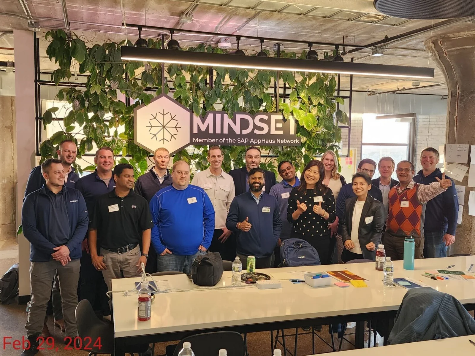 The Mindset team at the Minneapolis SAP AppHaus, gathered in front of the Member of the SAP AppHaus Network wall