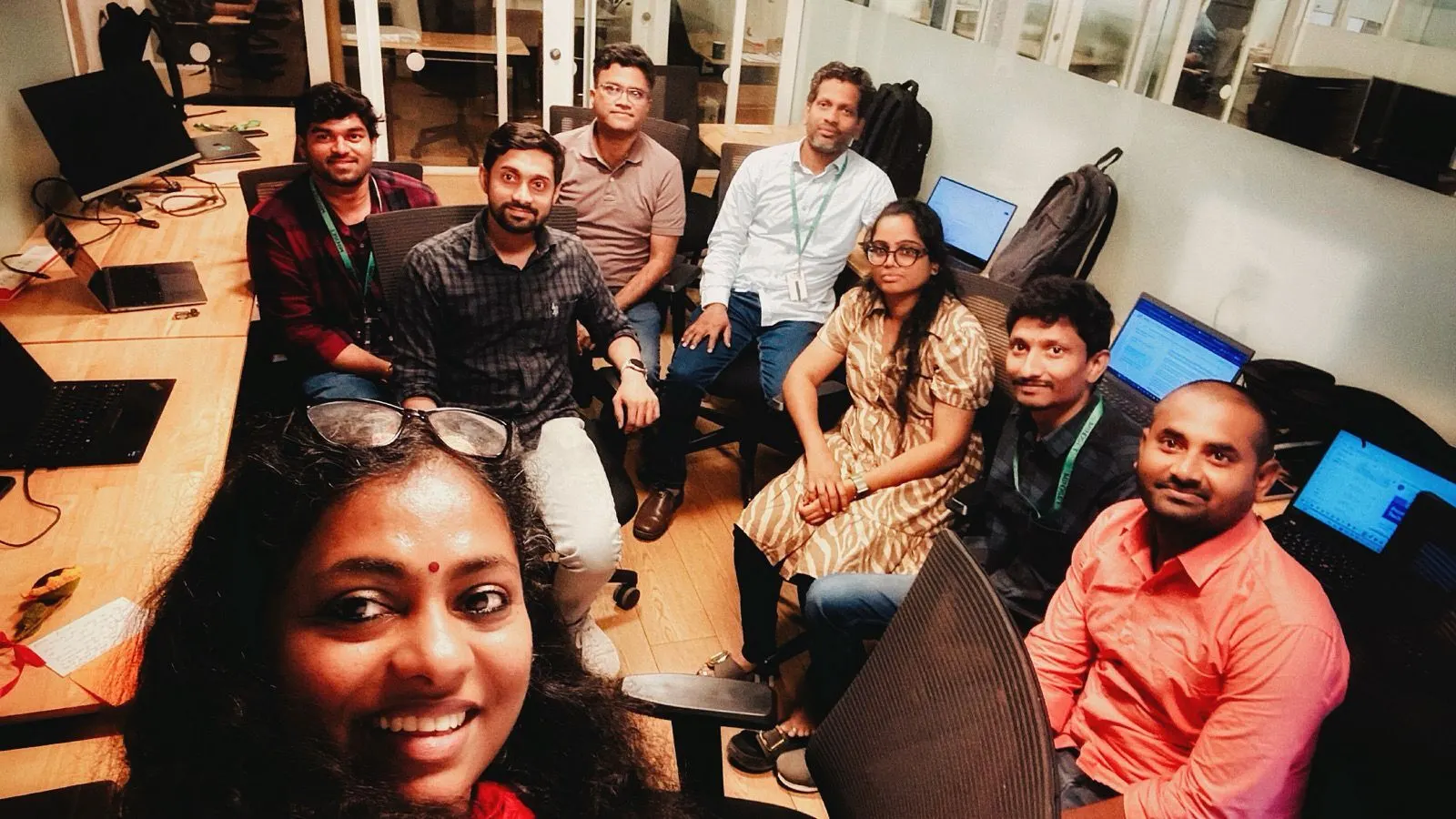 A Mindset Coding Dojo session in progress, developers gathered around screens