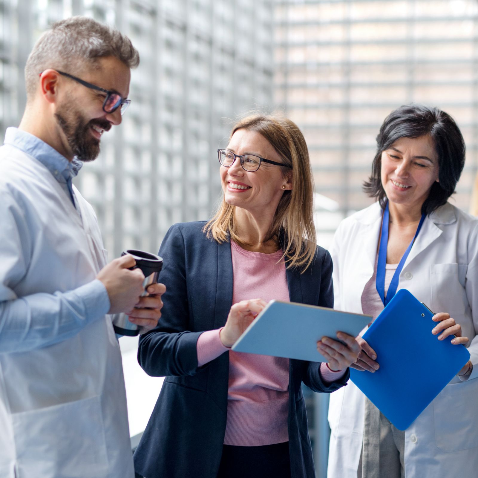 Doctors and staff talking in hospital