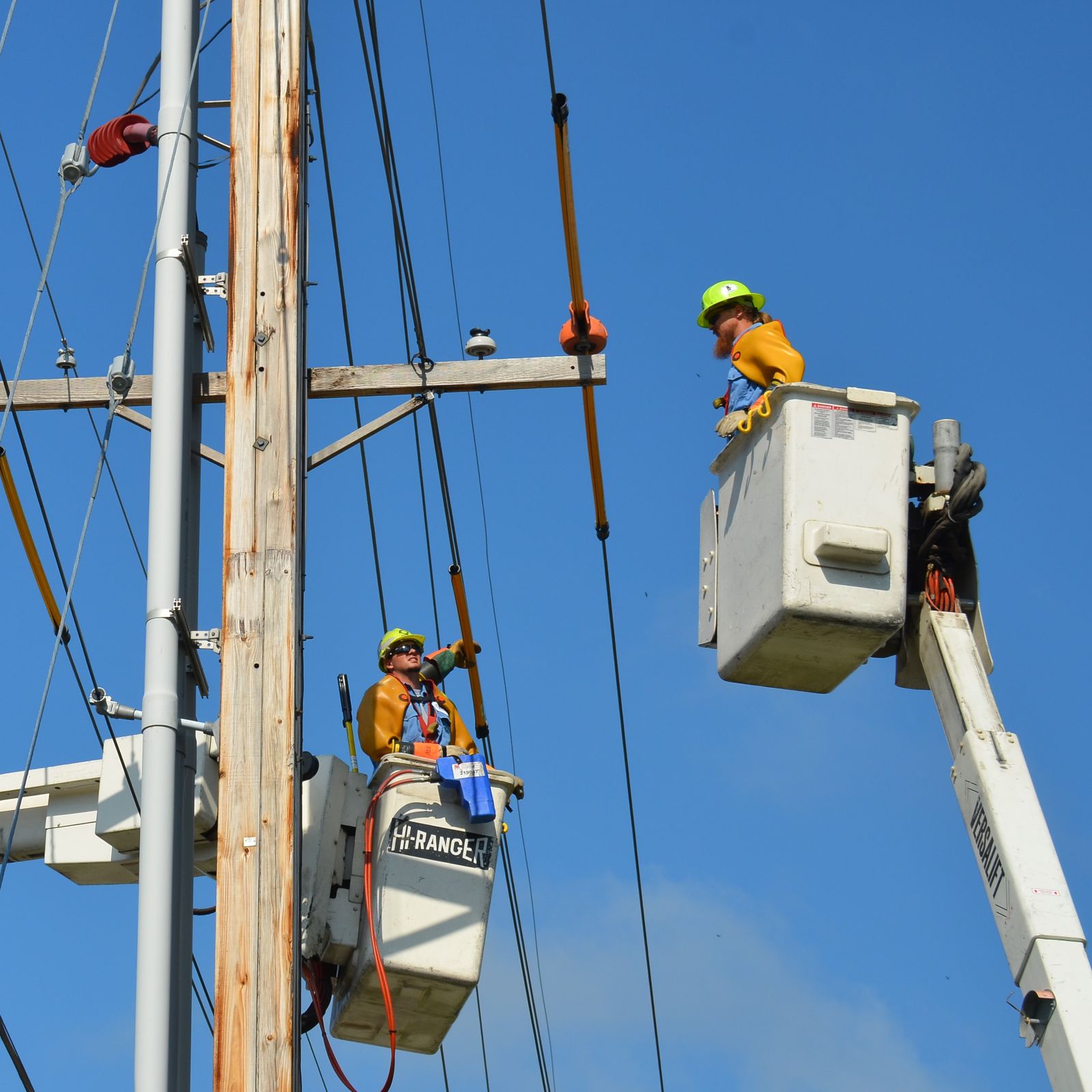 Workers fixing a power line