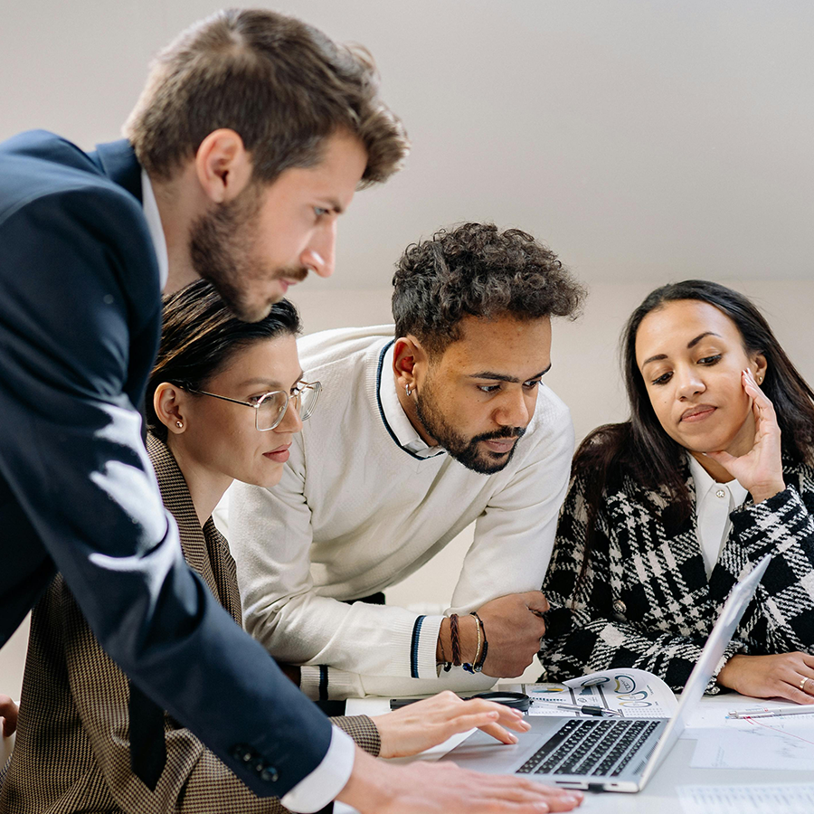 SAP consulting team collaborating on BTP strategy and implementation planning with laptop and documents