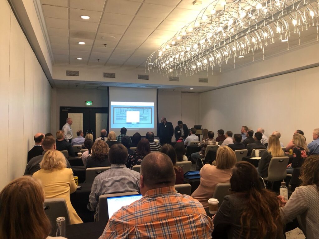 A full room of attendees at a Cargill client event presentation.